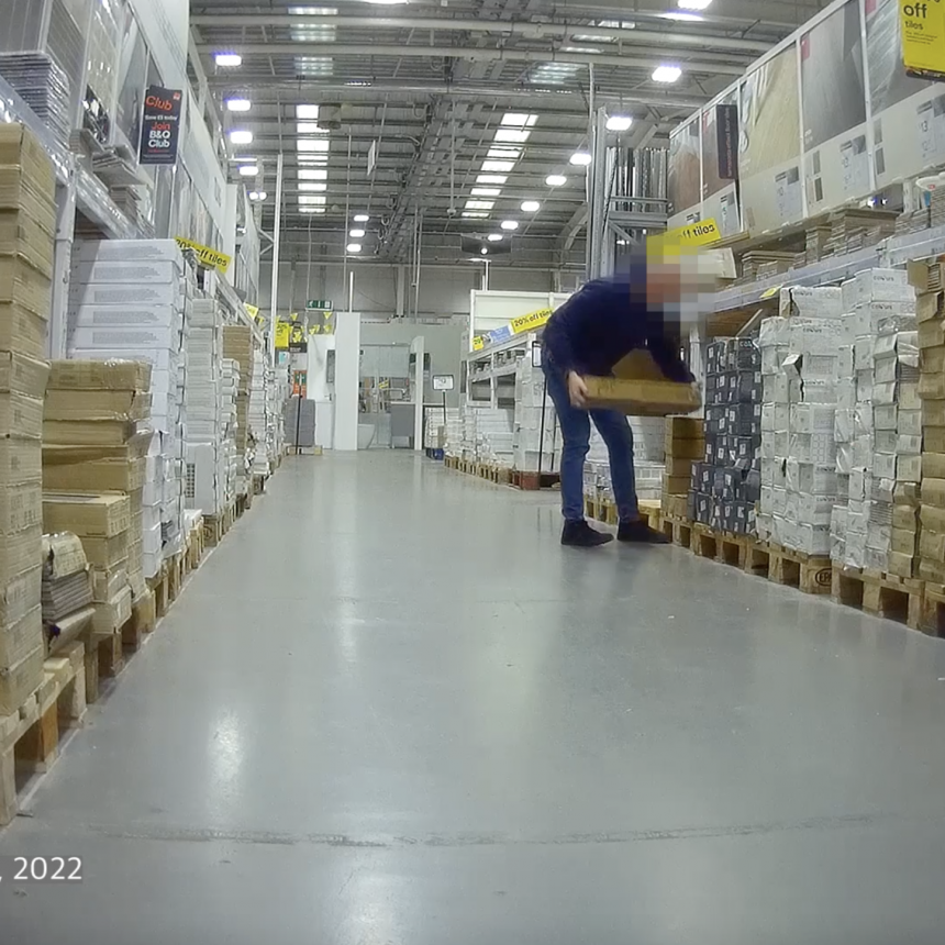 Employee Picking up flooring